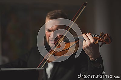Handsome guy with classic instrument violin Stock Photo