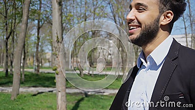 Handsome guy flirting with girls and showing peace finger sign Stock Photo