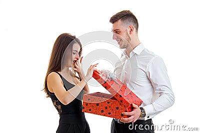 Handsome guy makes gift girl Stock Photo