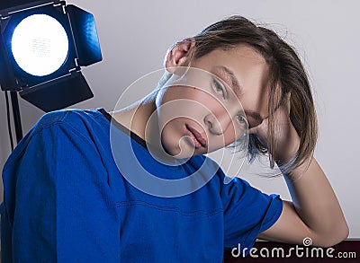 Handsome guy model with stylish haircut posing in the studio Stock Photo