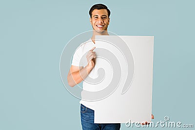 Happy man holding a big blank sign Stock Photo