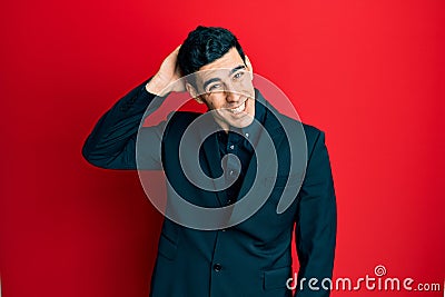 Handsome hispanic man wearing business clothes confuse and wonder about question Stock Photo