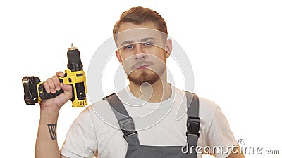 Handsome industry worker holding drilling machine Stock Photo