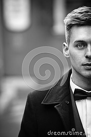 Handsome innocent blonde groom with blue eyes in a street face c Stock Photo