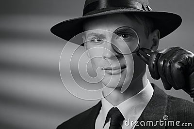 Handsome intelligent young detective in a hat Stock Photo