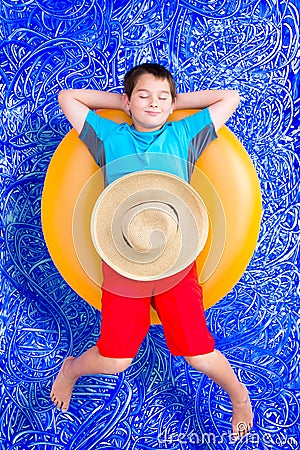 Handsome little boy dozing off in the pool Stock Photo