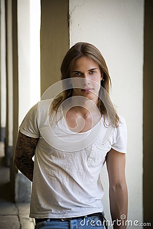 Handsome Long Hair Man in White Shirt Stock Photo