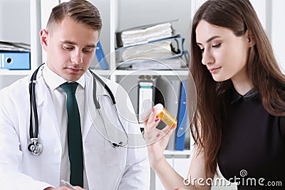 Handsome male doctor explain prescription while Stock Photo