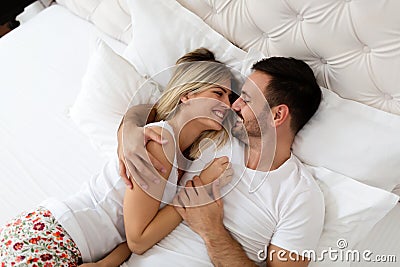 Handsome man and beautiful woman kissing each other Stock Photo