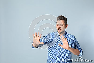 Handsome man being blinded Stock Photo