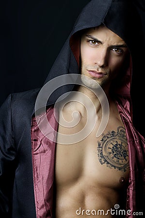 Handsome Man With A Black Hood Stock Photo