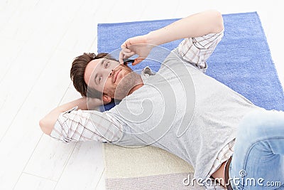 Handsome man chatting on mobile smiling Stock Photo