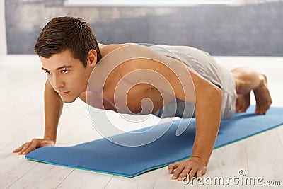 Handsome man doing push up Stock Photo