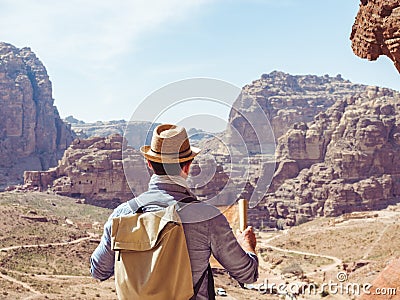 Handsome man, exploring the sights of of Petra Stock Photo