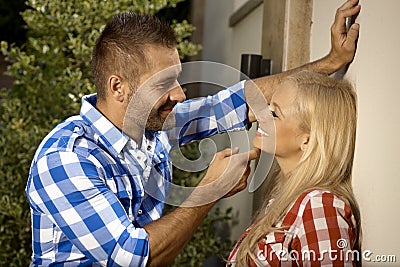 Handsome man flirting with young woman outdoors Stock Photo