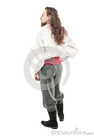 Handsome man in historical pirate costume isolated. Back pose Stock Photo