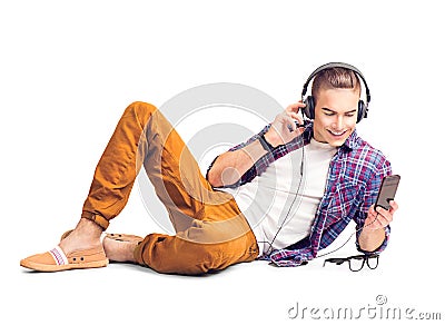 Handsome man listening to music in headphones with smartphone Stock Photo