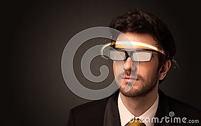 Handsome man looking with futuristic high tech glasses Stock Photo