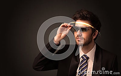 Handsome man looking with futuristic high tech glasses Stock Photo