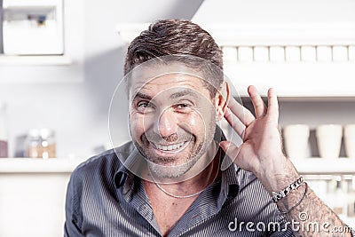 Handsome man makes gesture of not having understood Stock Photo