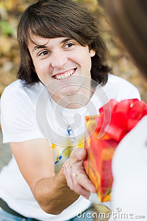 Handsome man making a gift Stock Photo