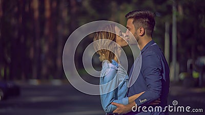 Handsome man ogles on beautiful woman in the town. Stock Photo