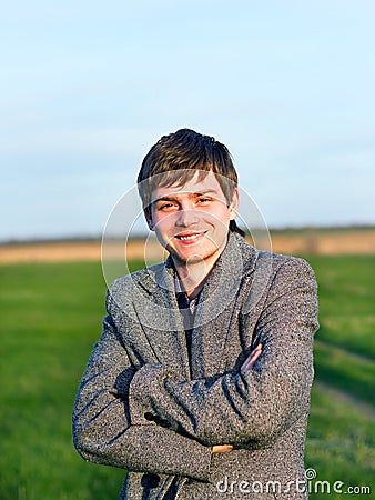 Handsome man outdoors portrait. Spring colors. Stock Photo