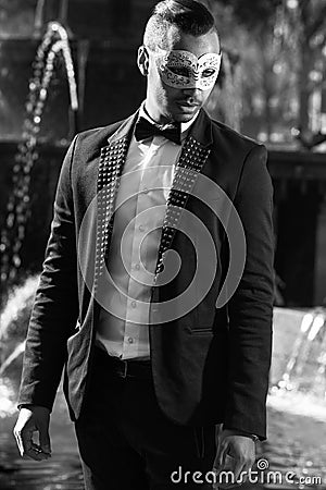 Handsome man ready to attend a masquerade party Stock Photo