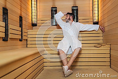 Man relaxing in sauna and staying healthy Stock Photo