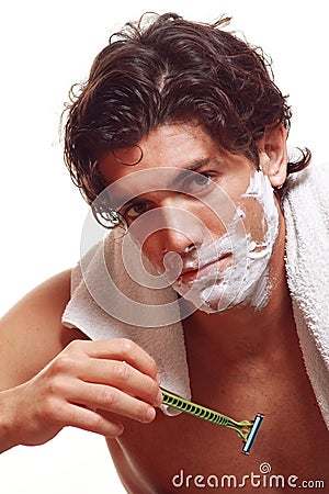 Handsome man shaving Stock Photo