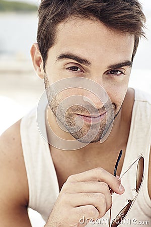 Handsome man sitting outdoors Stock Photo