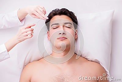 The handsome man in spa massage concept Stock Photo