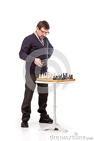 A handsome man in a suit and glasses, with a pipe for smoking an Stock Photo