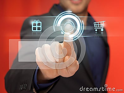 Handsome man in suit pressing virtual button Stock Photo