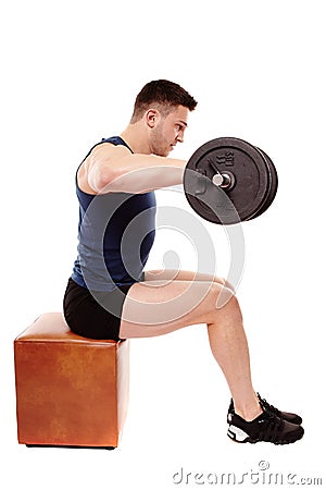 Handsome man working with heavy dumbbells Stock Photo