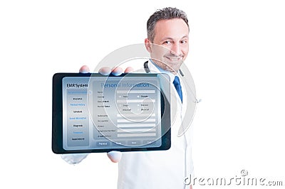 Handsome medic holding modern tablet in hands Stock Photo