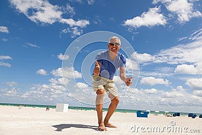 Handsome middle age man at the beach Stock Photo