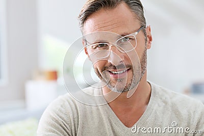 Handsome middle-aged man wearing white eyeglasses Stock Photo