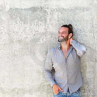 Handsome modern man with beard smiling Stock Photo