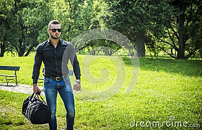 Handsome Muscular Hunk Man Outdoor in City Park Stock Photo