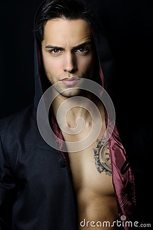 Handsome mysterious man with a tattoo Stock Photo