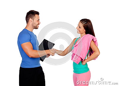 Handsome personal trainer with a attractive girl Stock Photo