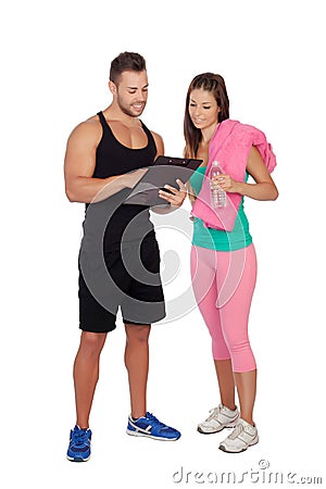 Handsome personal trainer with a attractive girl Stock Photo