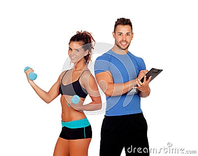 Handsome personal trainer with beautiful girl with dumbbells Stock Photo