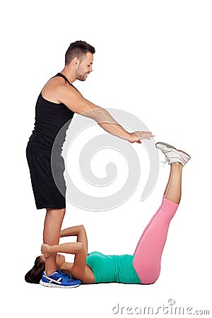 Handsome personal trainer helping a girl in her training Stock Photo