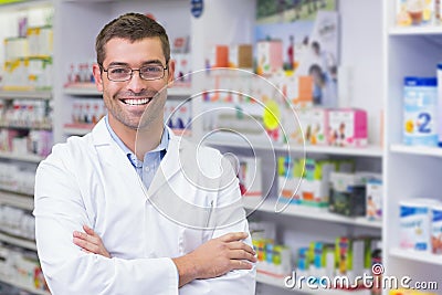 Handsome pharmacist smiling at camera Stock Photo