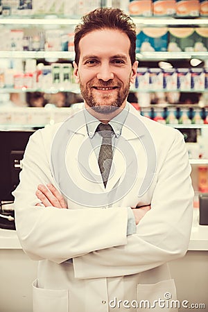 Handsome pharmacist at work Stock Photo