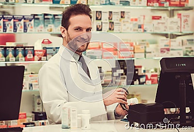 Handsome pharmacist at work Stock Photo