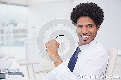 Handsome photo editor working at desk Stock Photo