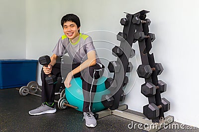 A handsome power athletic man bodybuilder doing exercises with d Stock Photo